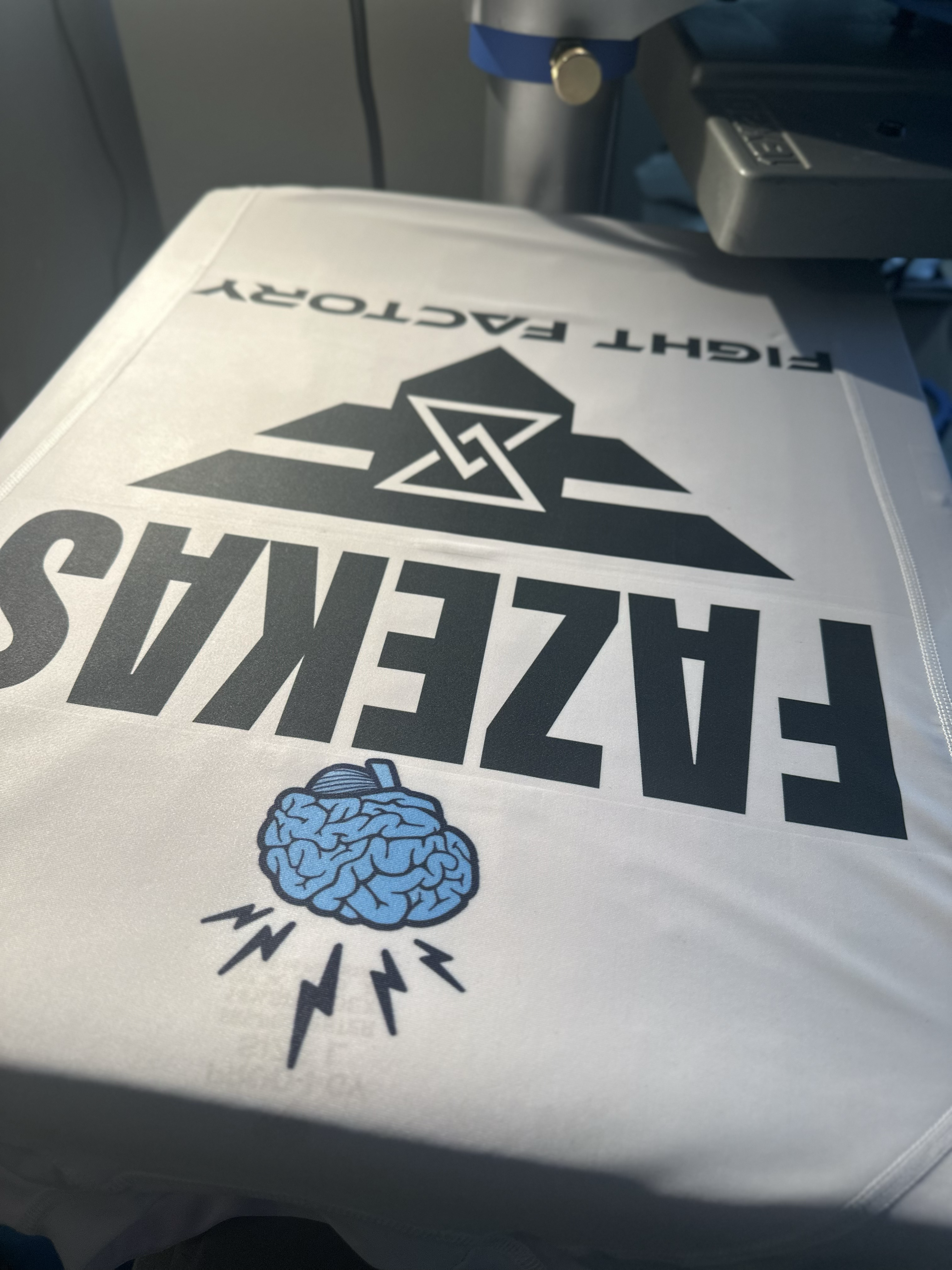 Printed white apparel on a heat press